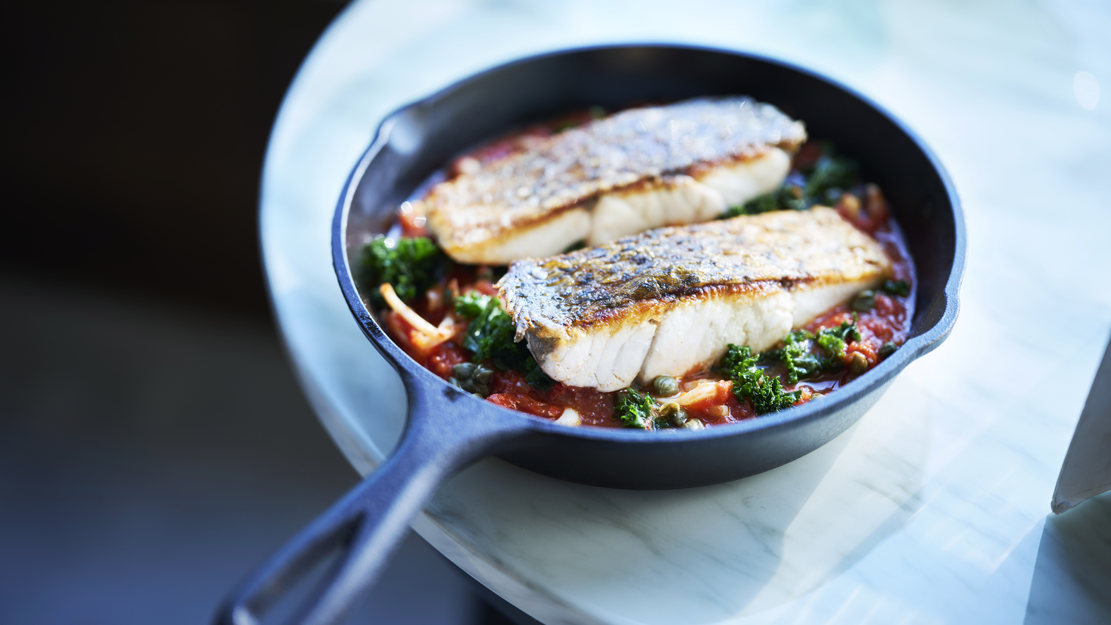 Pan fried barramundi with calamari, tomato and capers