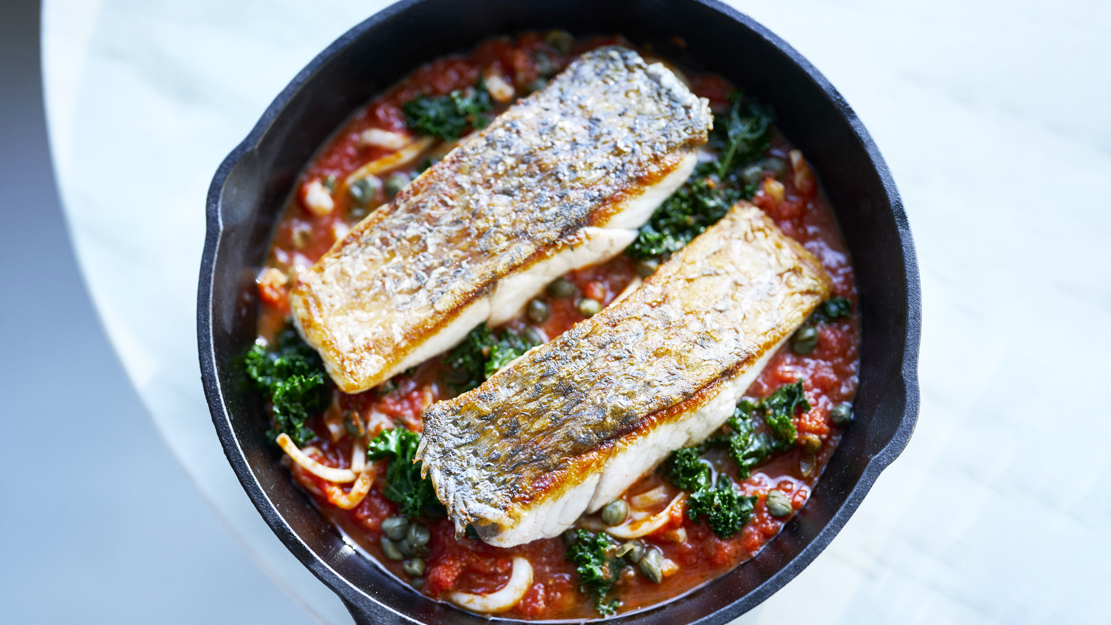 Pan fried barramundi with calamari, tomato and capers