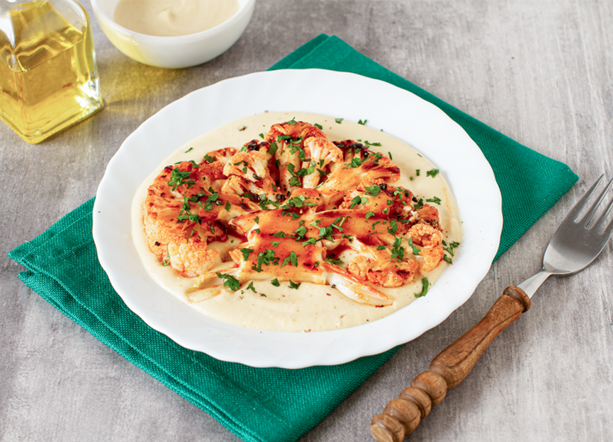 Cauliflower steak with herbed tahini sauce