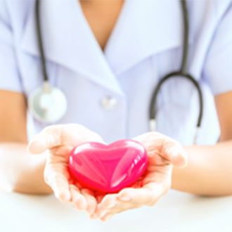 Nurse holding a heart