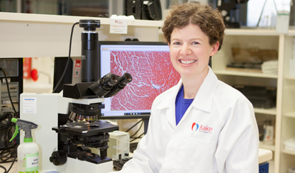 Kate Weeks at a microscope