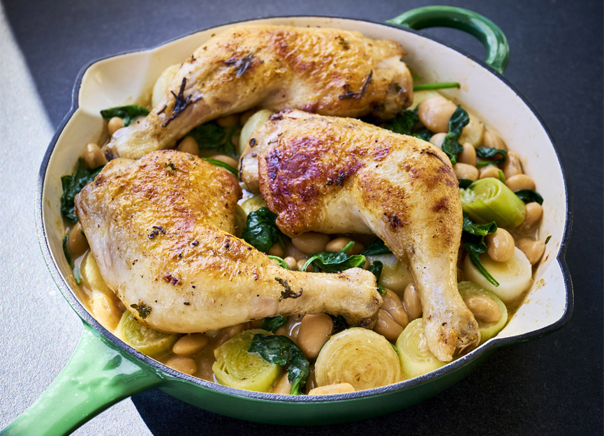 Roasted chicken with butter beans, leeks and baby onions