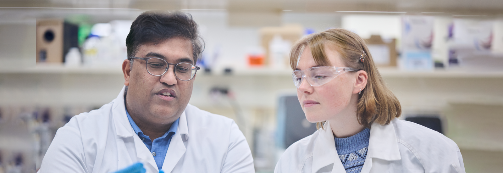 Student working with senior researcher